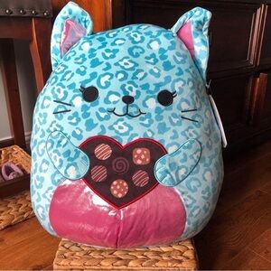 Squishmallows Caitroina the Valentine's Day leopard cat with arms and chocolates